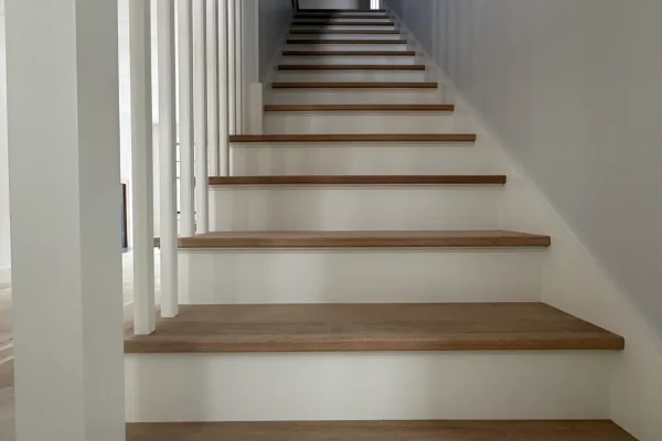 Trim and finish painting service for residential interiors, highlighting precise craftsmanship and clean, detailed work. The process includes careful surface preparation, sanding, caulking, priming, and smooth paint application on baseboards, crown molding, window and door trims, frames, and detailed finishes. Crisp, sharp lines and a refined look that elevate the overall design, add contrast, and enhance the value of your space. Professional trim painting, finish painting, detailed interior painting, residential painting services, home improvement, baseboard painting, crown molding painting, door and window trim painting, high-end finishes, clean and professional results, premium materials, licensed painters, Massachusetts painting company, Cape Cod finish painting, flawless results.